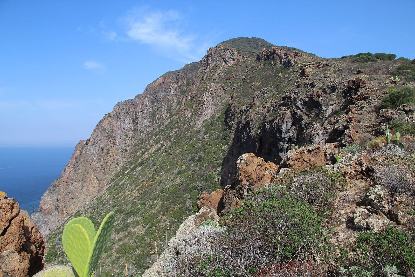 Spiaggia di Punta Corvo — wild dark-sand beach by the steps